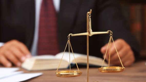 Lawyer at his desk with scales
