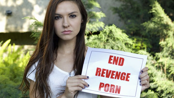 Woman showing end revenge porn sign