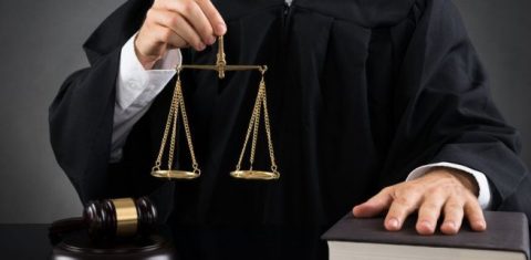 Judge holding justice scale