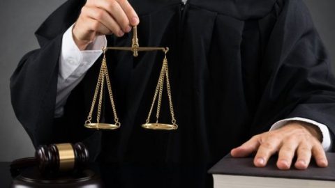 Judge holding justice scale