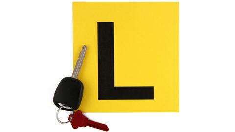 Learner driver l plate and car keys