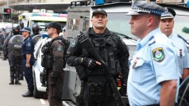 Police officers with semi automatic weapons