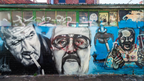 Graffiti of criminals on a wall