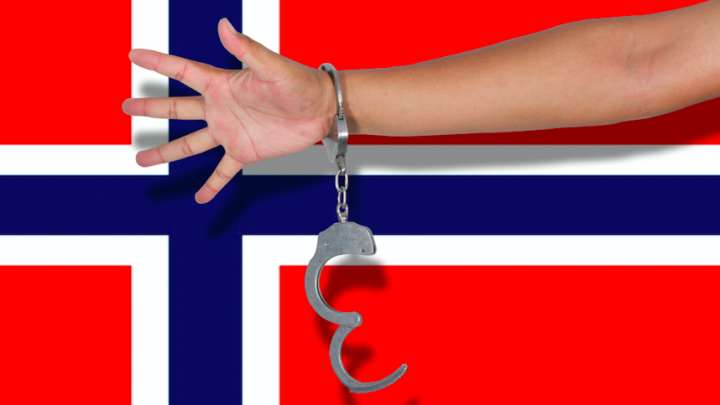 Norway flag and arm handcuffed