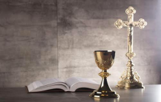Catholic Church's bible, cross, and goblet