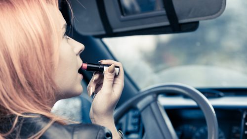 Putting makeup on while driving