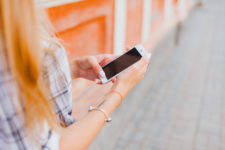 Woman walking with iPhone