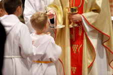 Priest and children