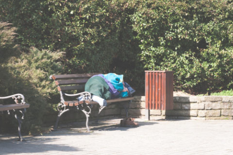 Homeless man on bench
