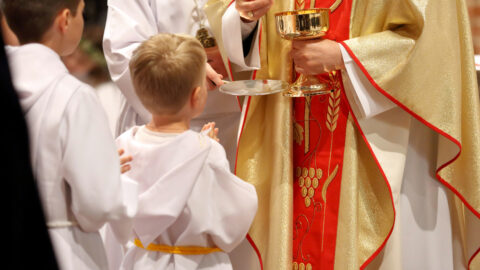 Priest and child