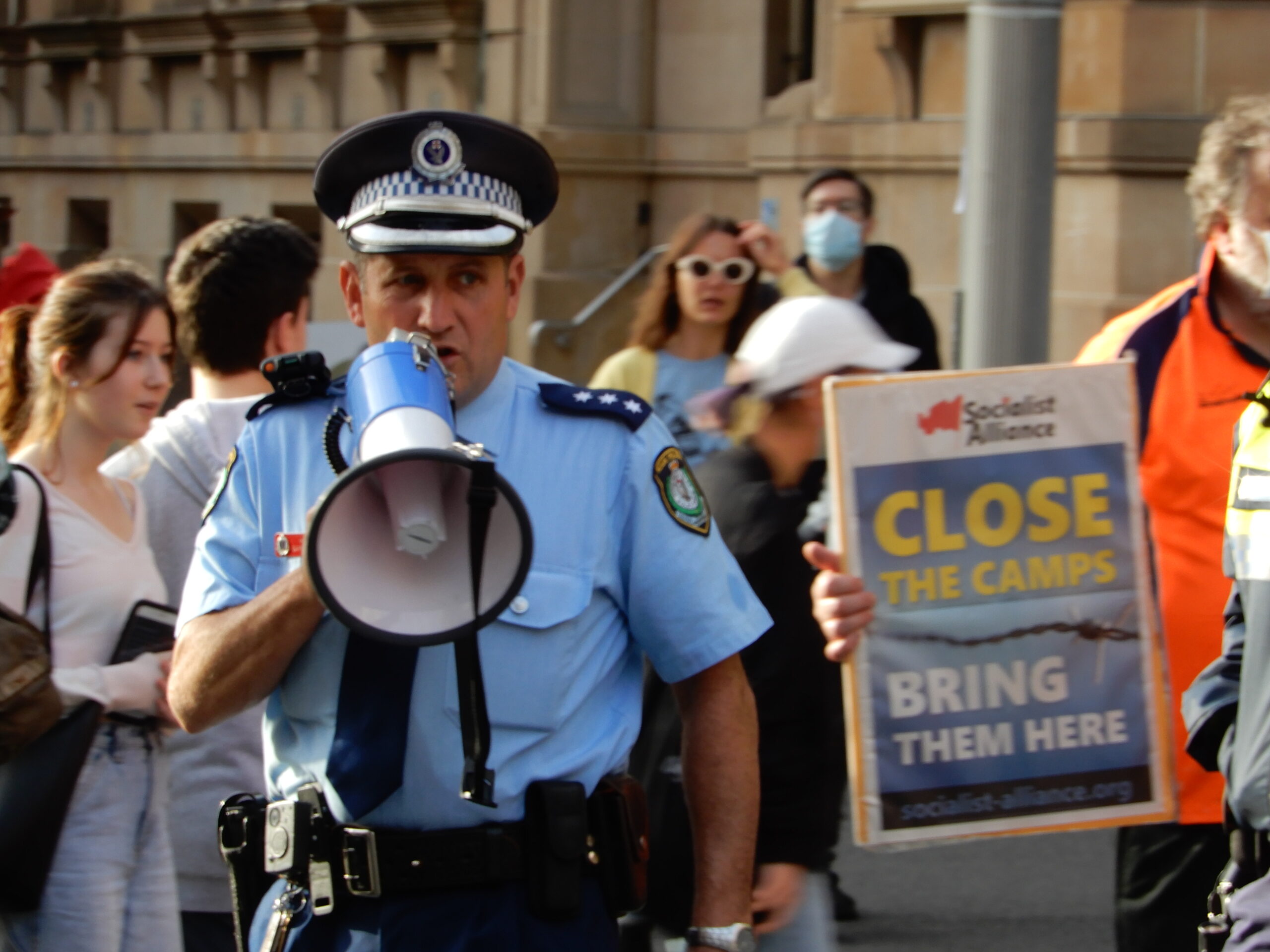 Officer in charge closing down refugee rally in Chinatown on 13 June 2020