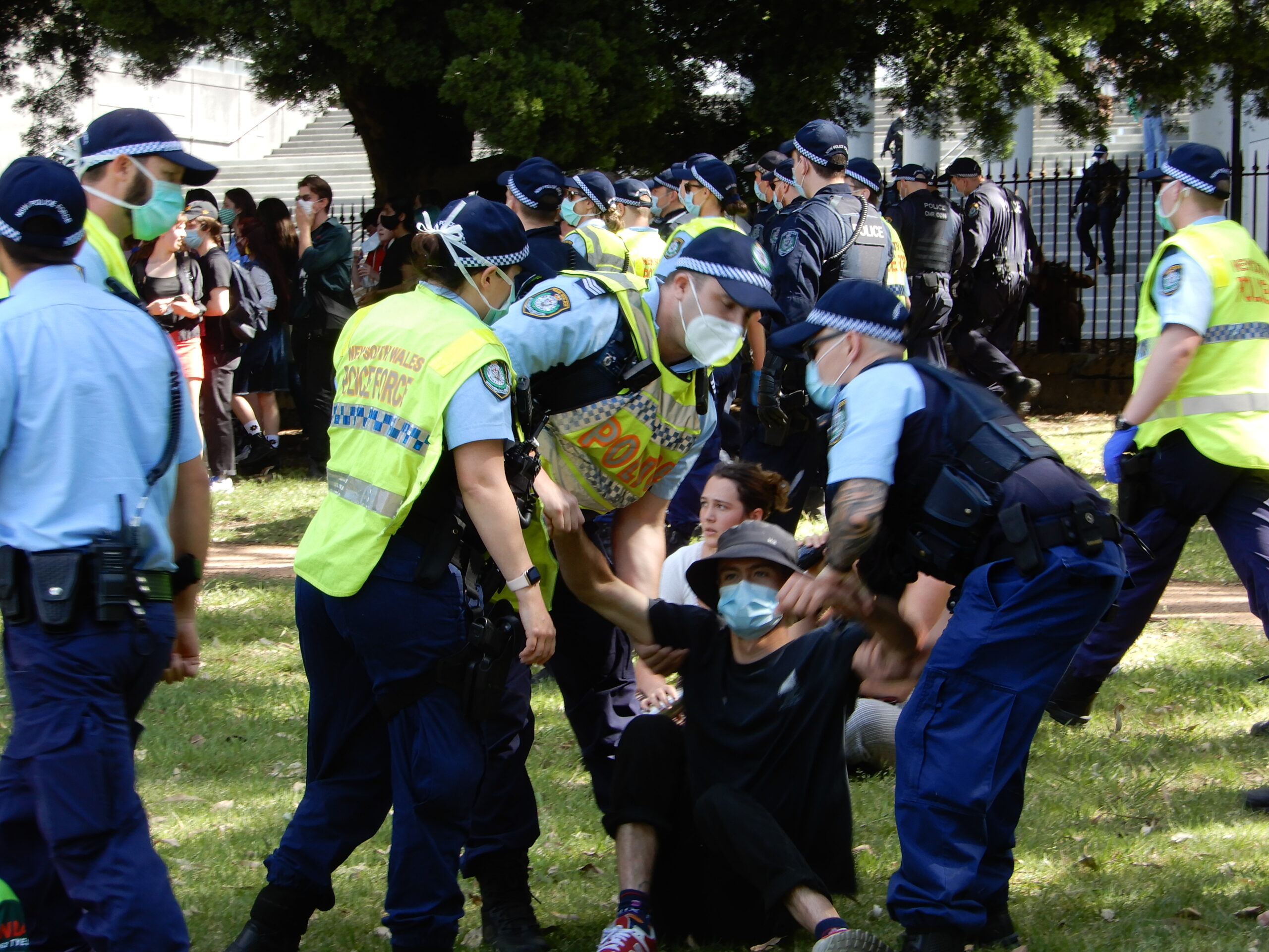 Police pick up a demonstrator