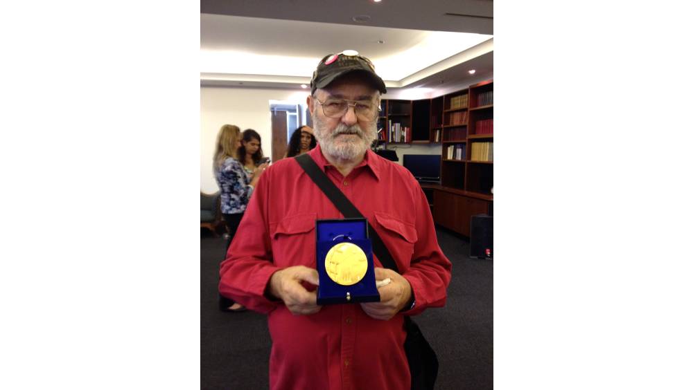 Uncle Ray Jackson receiving the French Human Rights Medal at the French embassy in Sydney in 2013. Photo supplied by Deathscapes. 