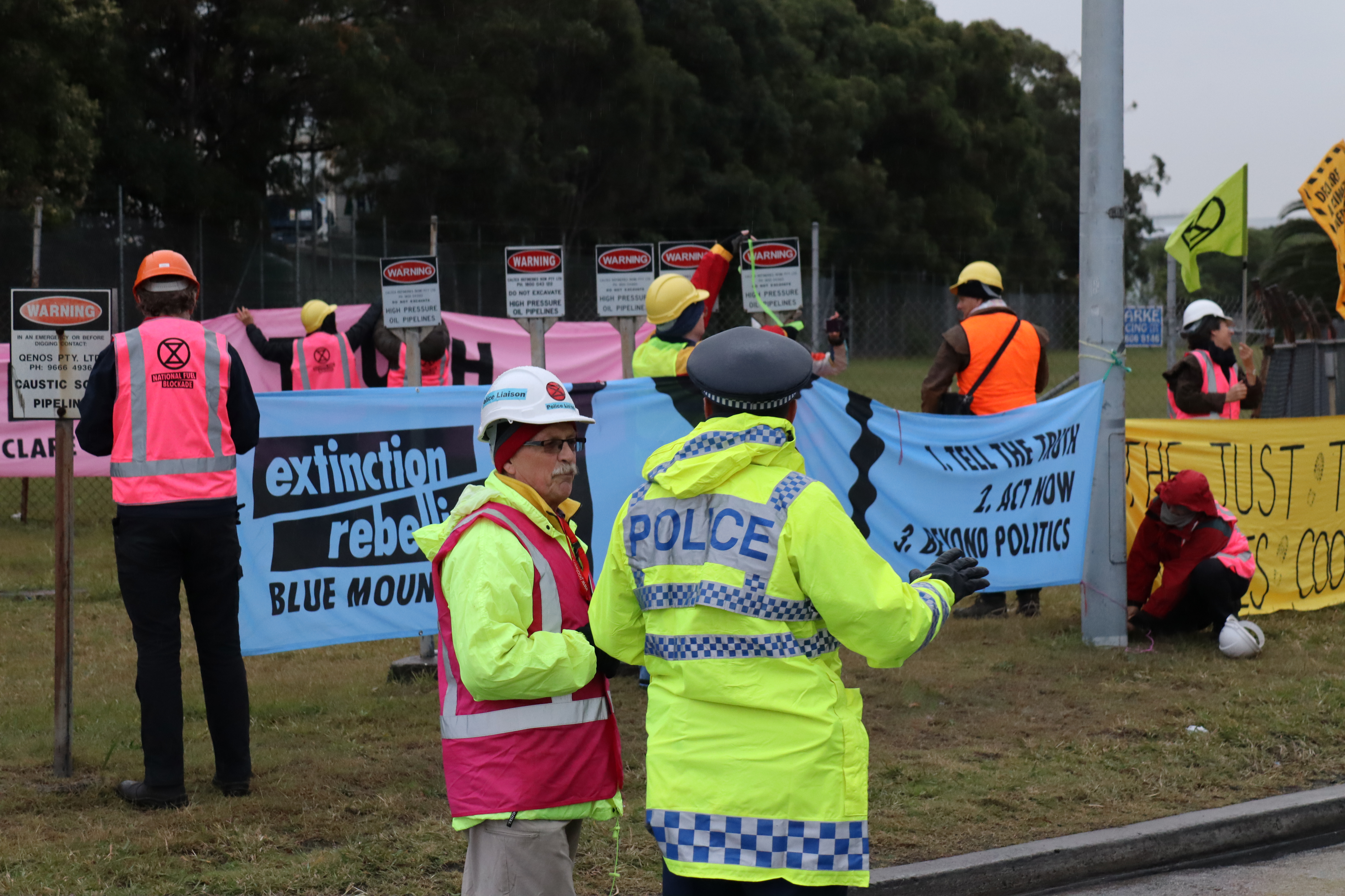 XR legal observer liaises with NSW police officer