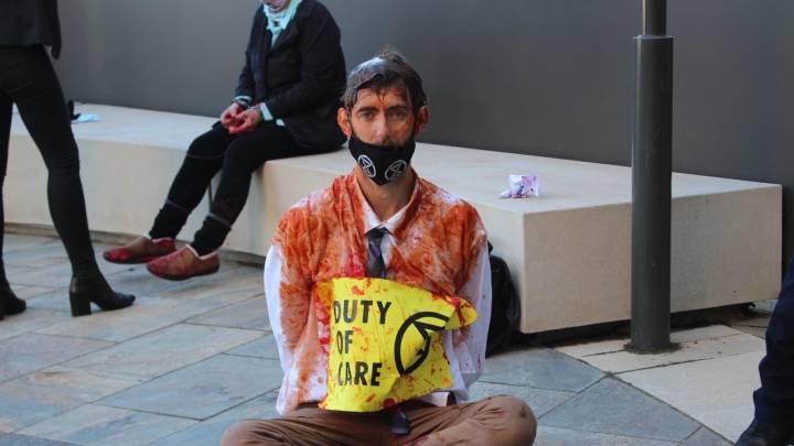 XR activist Andrew George after storming the foyer of the environment department