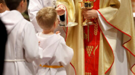 Priest and children