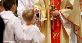 Priest and children