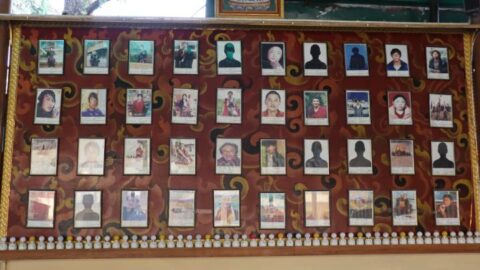 A wall displaying photos of just some of the 159 Tibetans who have self-immolated since 2009 in protest of oppressive Chinese rule