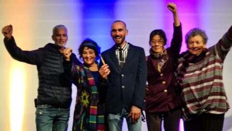 Former Australian soccer player Craig Foster, Fabia Claridge, refugee and painter Mostafa “Moz” Azimitabar, People Just Like US member Joyce Fu and a supporter. Moz had just given a speech