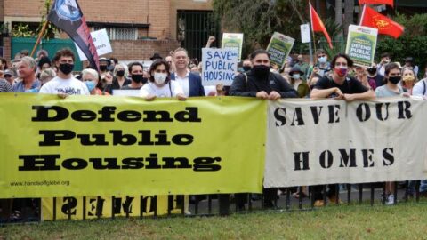 Locals protest the planned redevelopment of public housing units in Glebe