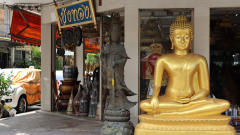 Buddhas for sale spill out onto the sidewalk