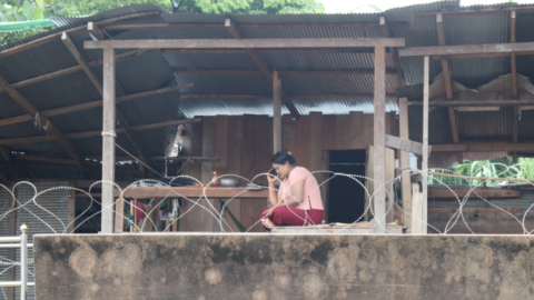 Displaced person resides beyond the razor wire in no-man’s-land at the Thai border