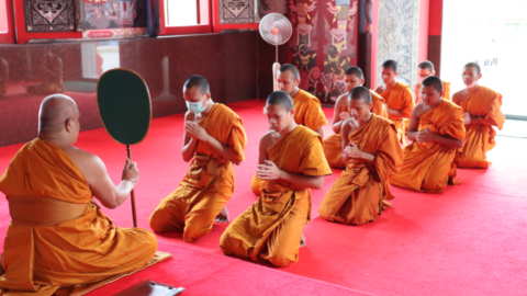 Novice monks at morning prayer in Nakhon Ratchasima