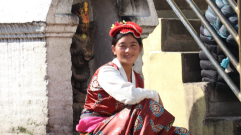A young Tibetan woman in traditional garb