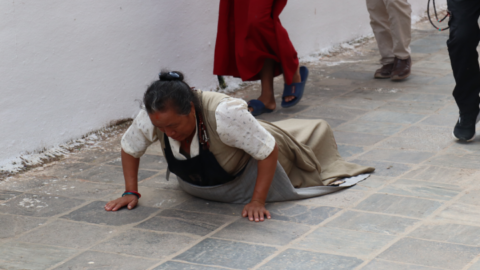 Some devout Buddhist practitioners will prostrate – kneel down on the ground and stretch out fully – at every step they take around the stupa for hours on end