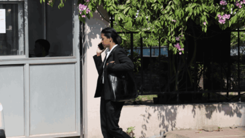 A young lawyer having a last-minute chat before she enters the High Court