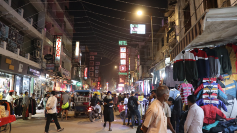 The neon lights of the Main Bazaar advertising hotels of questionable quality at very cheap prices for train commuters and backpackers alike