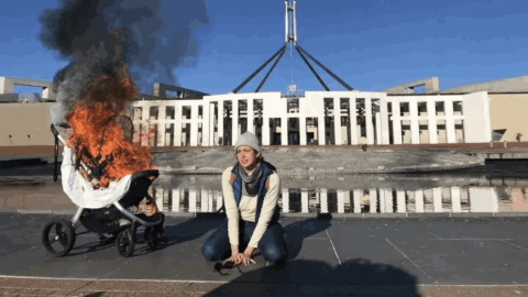 The shot of Violet Coco acting like a crying mother next to a burning pram before Parliament House in Canberra has become an iconic image of the Australian climate movement