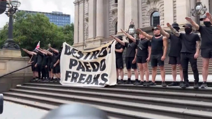 National Socialist Network members perform the Nazi salute before Parliament House in Melbourne. Photo credit: Victorian Socialists