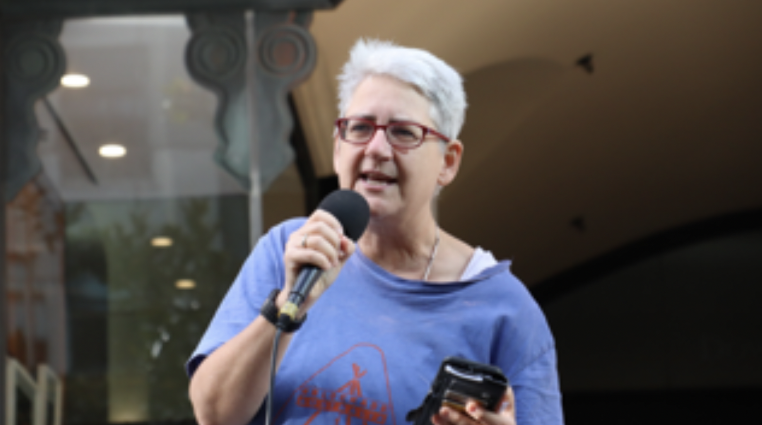 Peace and climate defence activist Margaret Pestorius addresses a rally at Sydney’s Downing Centre as Violet CoCo’s appeal took place inside