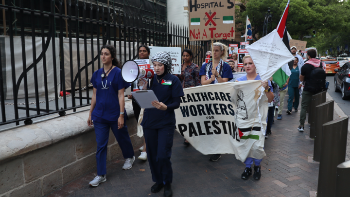 Healthcare Workers for Palestine call out the names of their murdered colleagues in Gaza as they march
