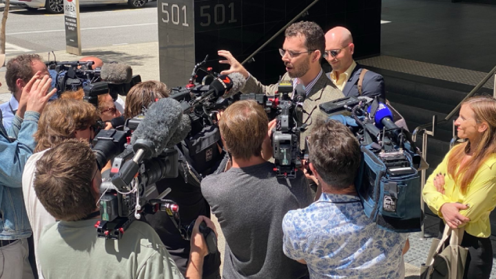 The Disrupt Burrup Hub trio facing court this Friday. Gerard Mazza is speaking to the press, as Jesse Noakes is behind him, and Tahlia Stolarski is to his side