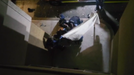 Police Officers restrain gay man