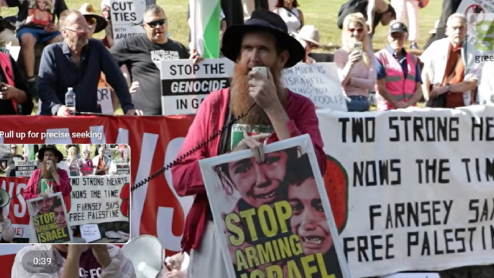 Socialist Alliance member Alex Bainbridge speaking at the Justice for Palestine Magan-djin Not Our Laws rally, not long before he was surrounded by a group of Queensland police officers and arrested for holdin