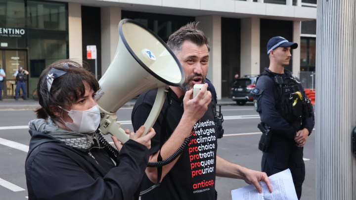 Anticop founder Tom Raue addresses the crowd before Downing. Photo credit Paul Gregoire