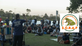 Padraic Gibson addressing the first SCRAP the Cooks River AI datacentre rally held on Bidjigal land at Wolli Creek’s Cahill Park on 9 October 2026