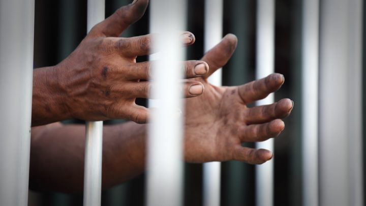 Black man in jail cell