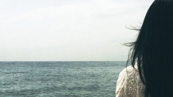 Woman by the sea water