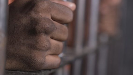 Coloured individual in prison