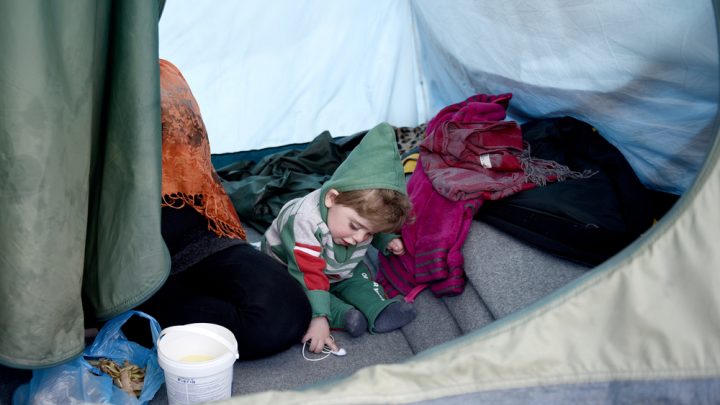 Child within an asylum tent