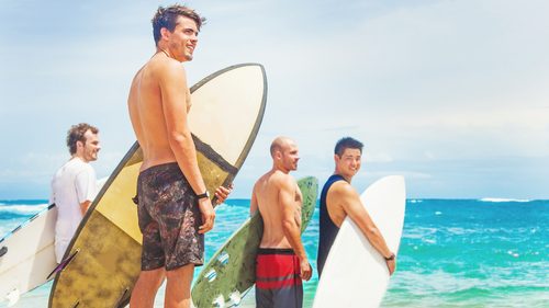 Surfers beach and surfboards