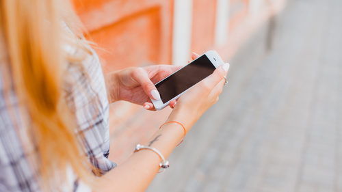Woman walking with iPhone
